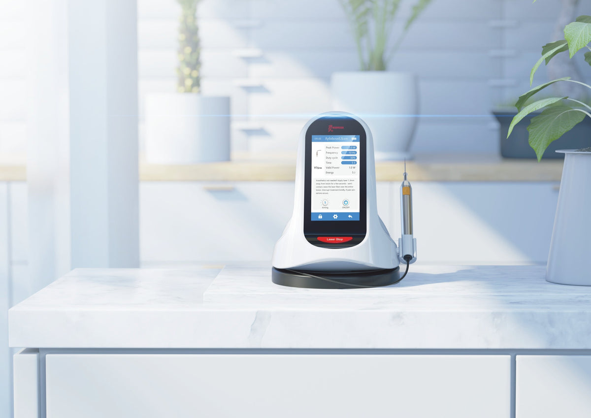 Woodpecker LX16 Plus soft tissue dental laser device placed on a sleek white countertop in a modern dental clinic. The device features a touchscreen interface displaying treatment options and settings. Its ergonomic design includes a laser handpiece positioned neatly in a docking station. Ideal for soft tissue procedures like gingivectomy, frenectomy, and periodontal therapy, ensuring precise, pain-free, and efficient dental treatments.